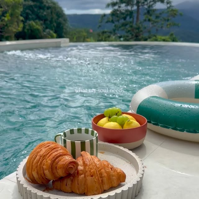 Poolside morning breakfast with croissants